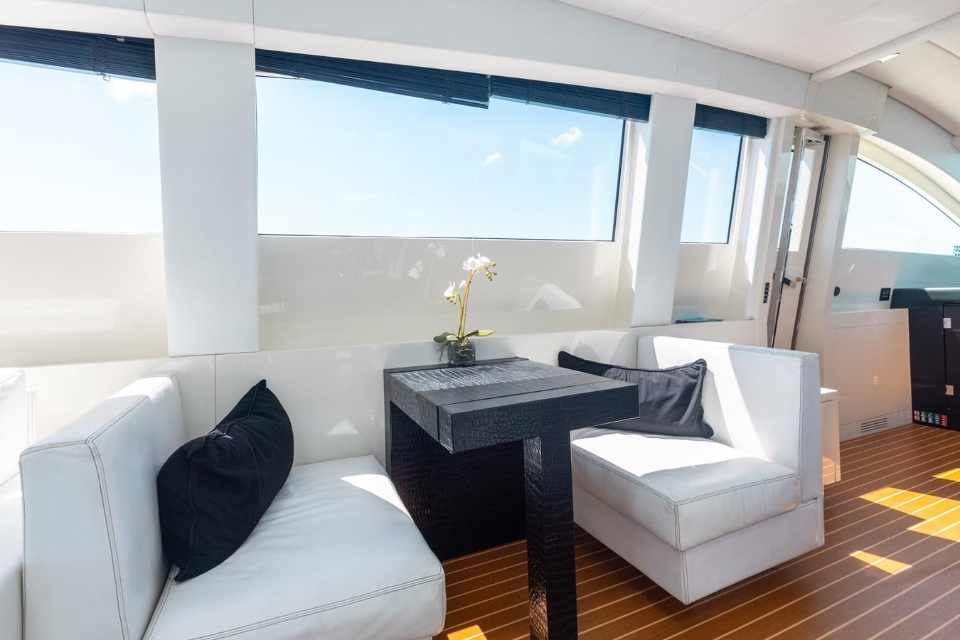 a room with a couch and a table aboard VENTURE Yacht for Sale