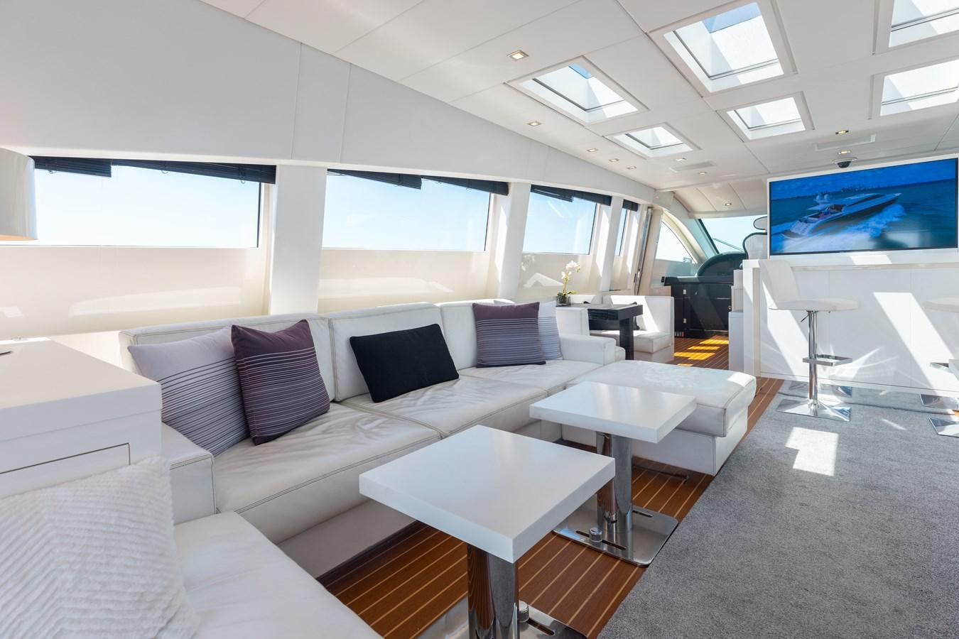 a room with a couch and a table aboard VENTURE Yacht for Sale