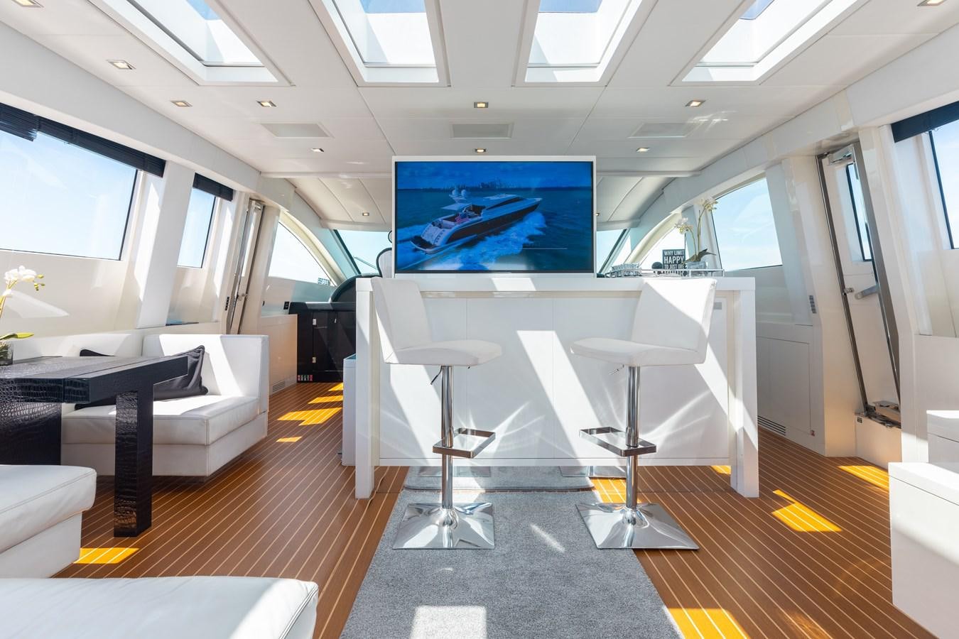 a room with a table and chairs aboard VENTURE Yacht for Sale