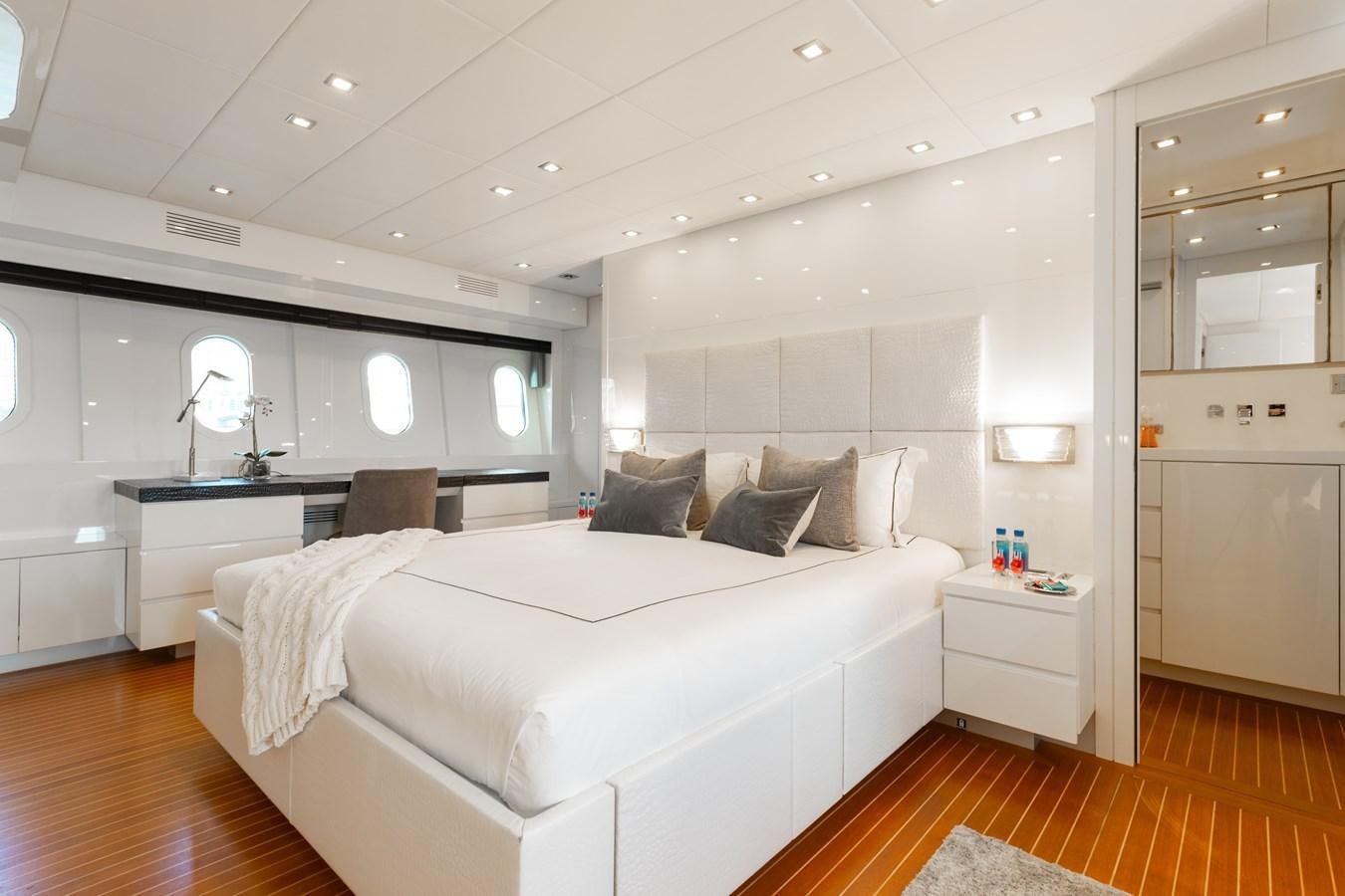a room with a bed and a desk aboard VENTURE Yacht for Sale