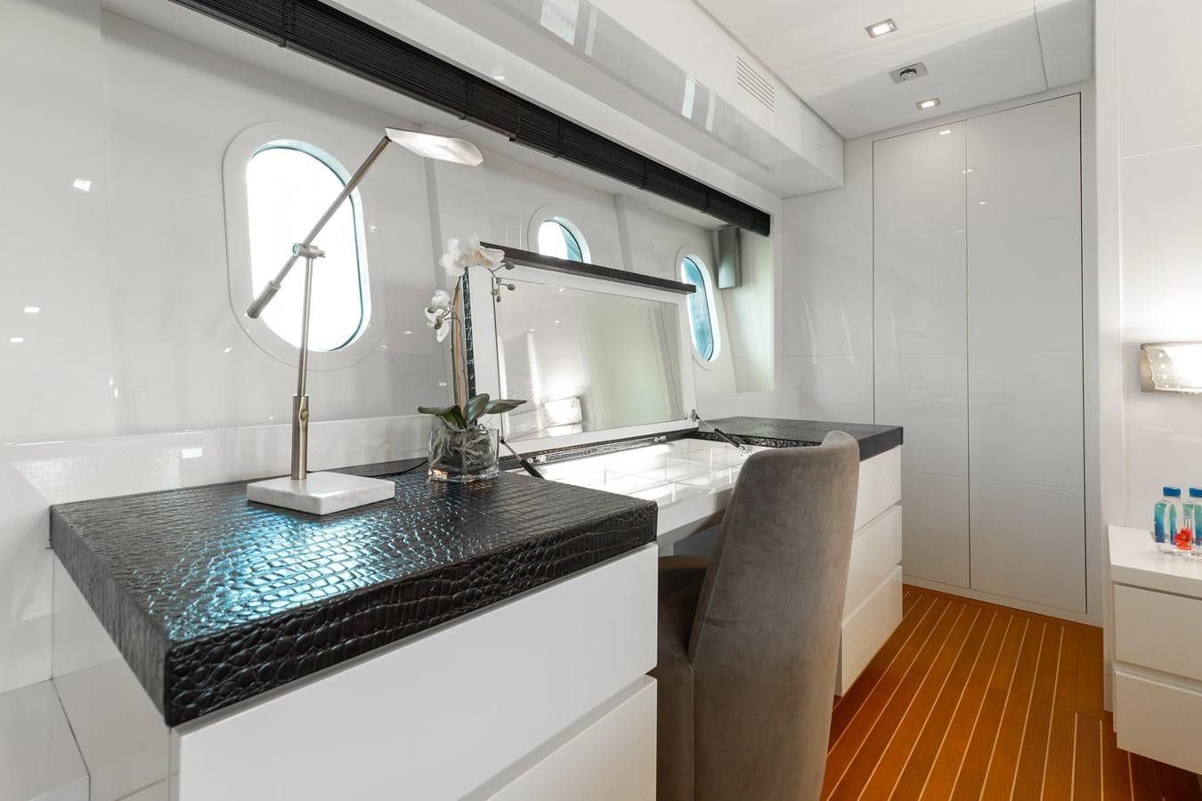a kitchen with a black countertop aboard VENTURE Yacht for Sale