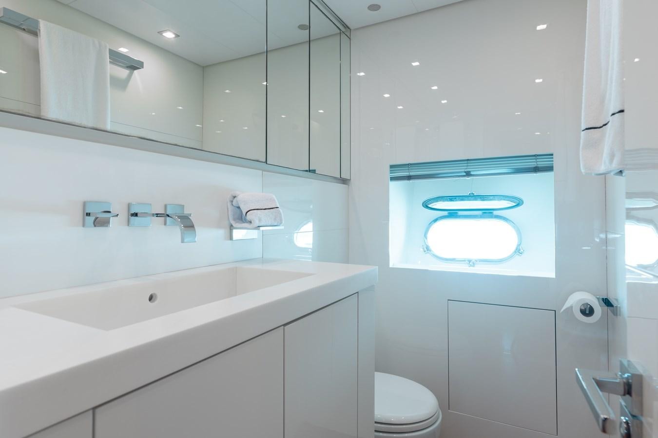 a bathroom with a large mirror aboard VENTURE Yacht for Sale