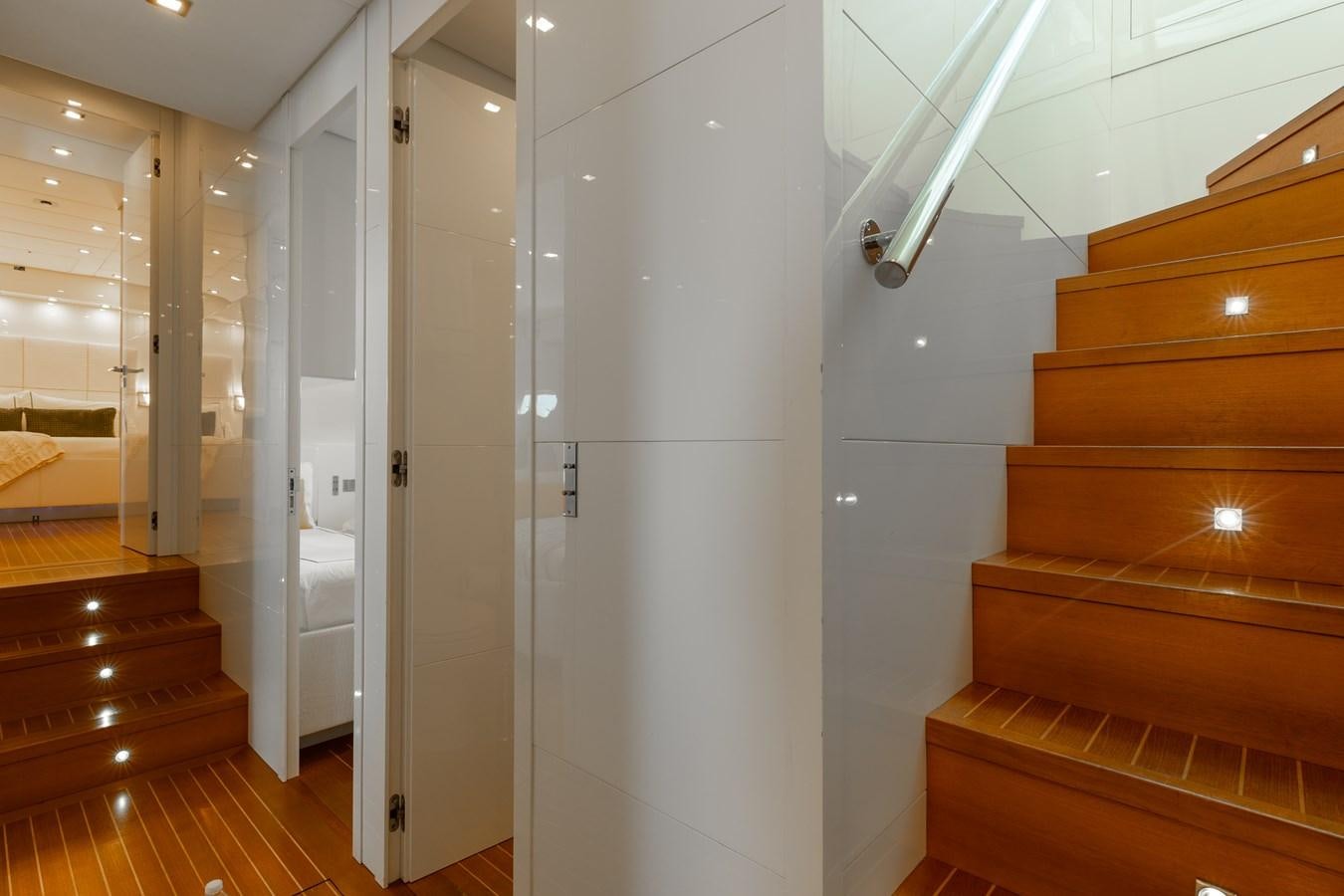 a room with a staircase and a door aboard VENTURE Yacht for Sale