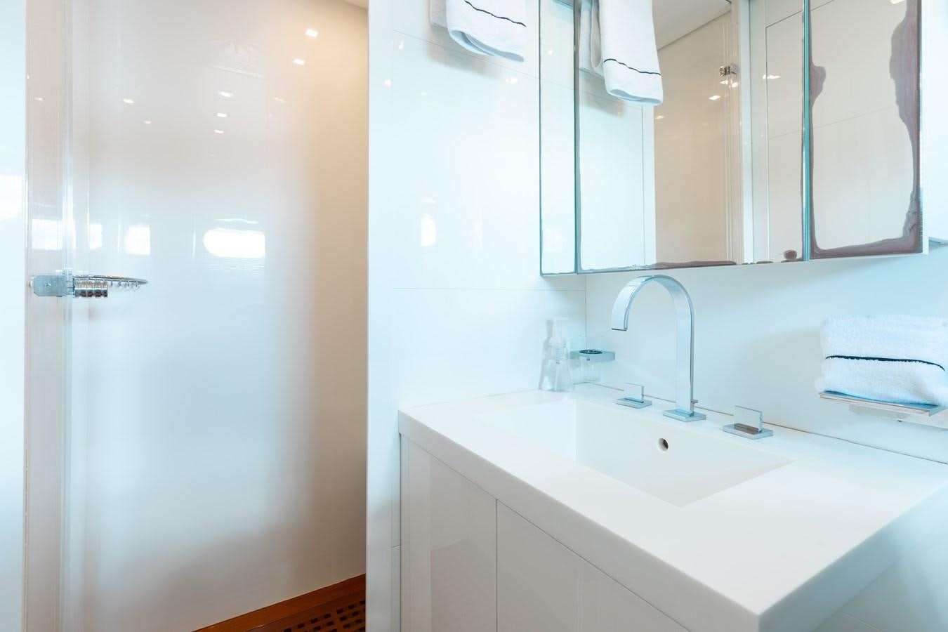 a bathroom with a sink and a mirror aboard VENTURE Yacht for Sale