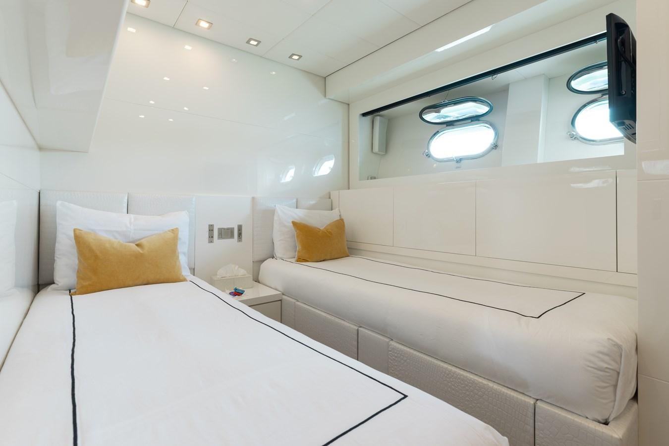 a room with a bed and a desk aboard VENTURE Yacht for Sale