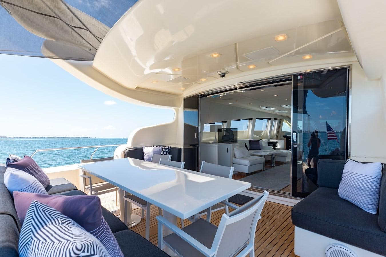 a room with a table and chairs aboard VENTURE Yacht for Sale