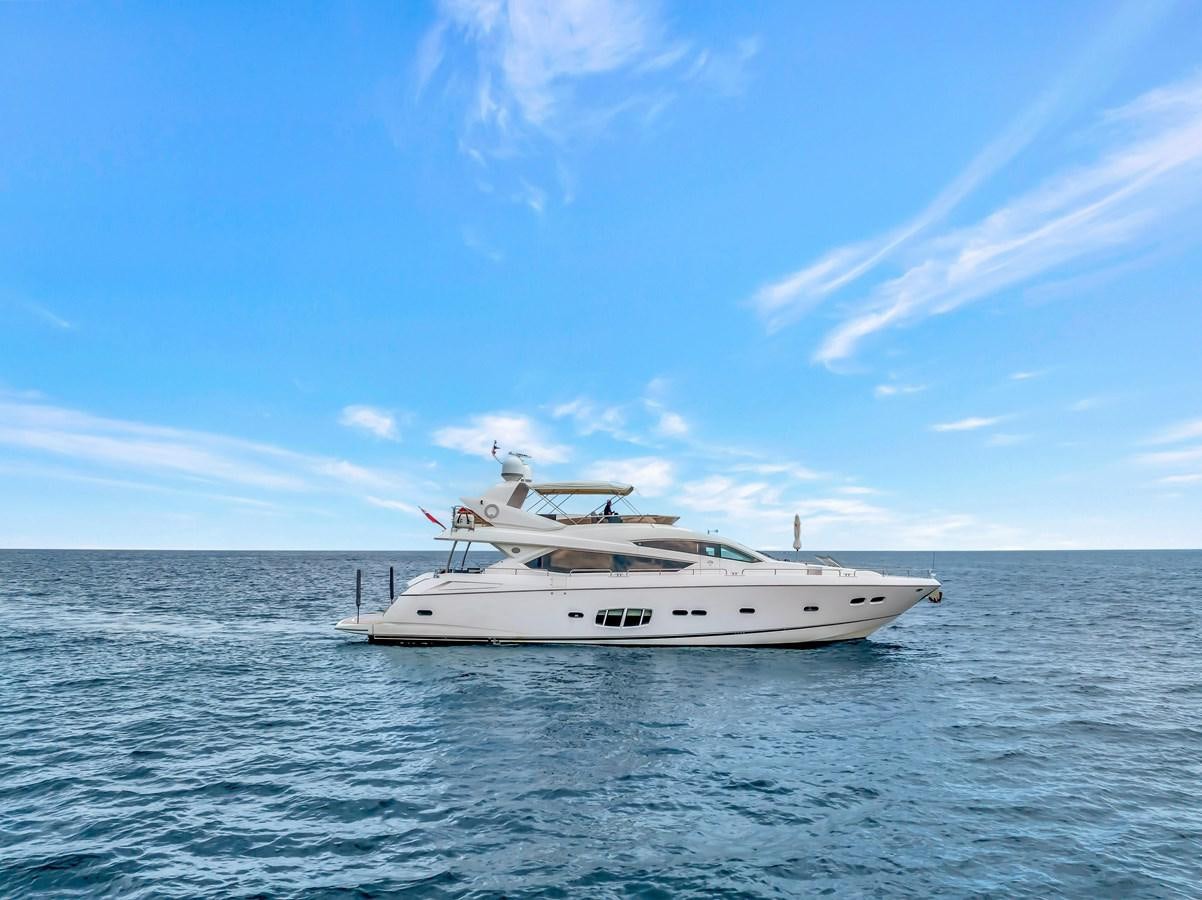 a white boat in the water aboard QUATTRO Yacht for Sale
