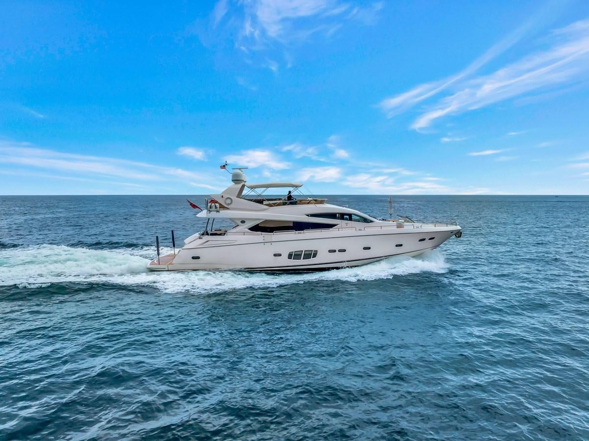 a white yacht in the water aboard QUATTRO Yacht for Sale