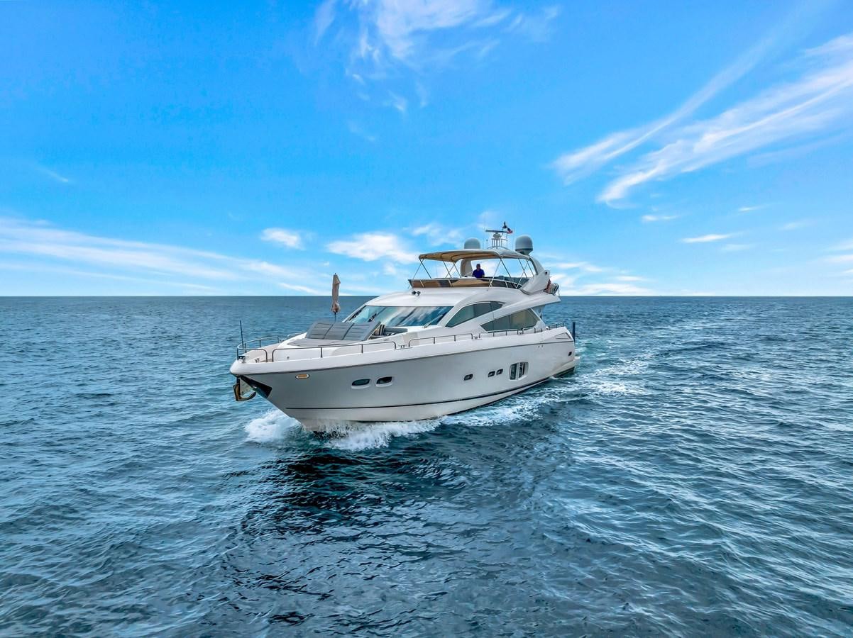 a white yacht in the water aboard QUATTRO Yacht for Sale
