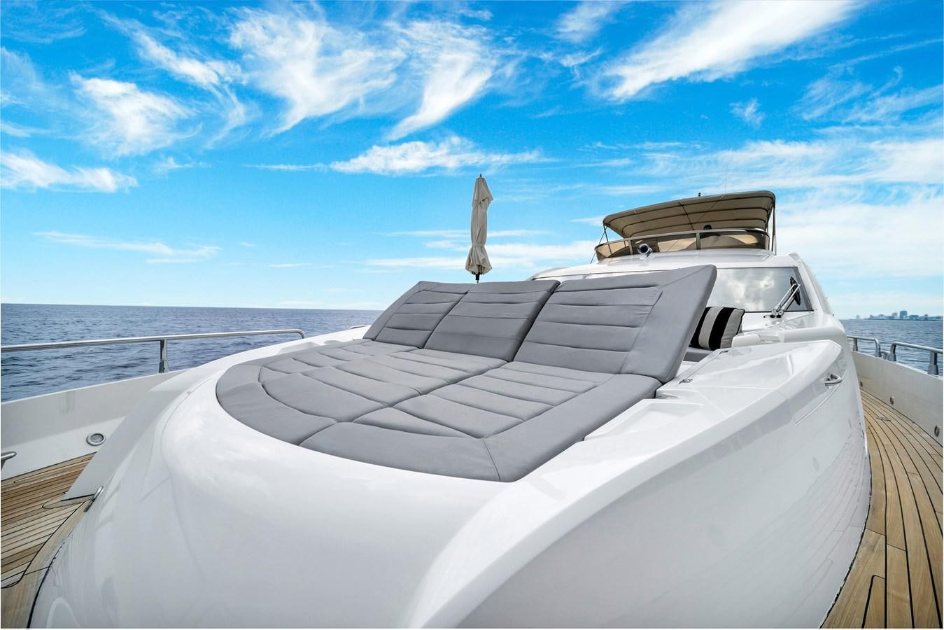 a white boat with a bird on the front aboard QUATTRO Yacht for Sale