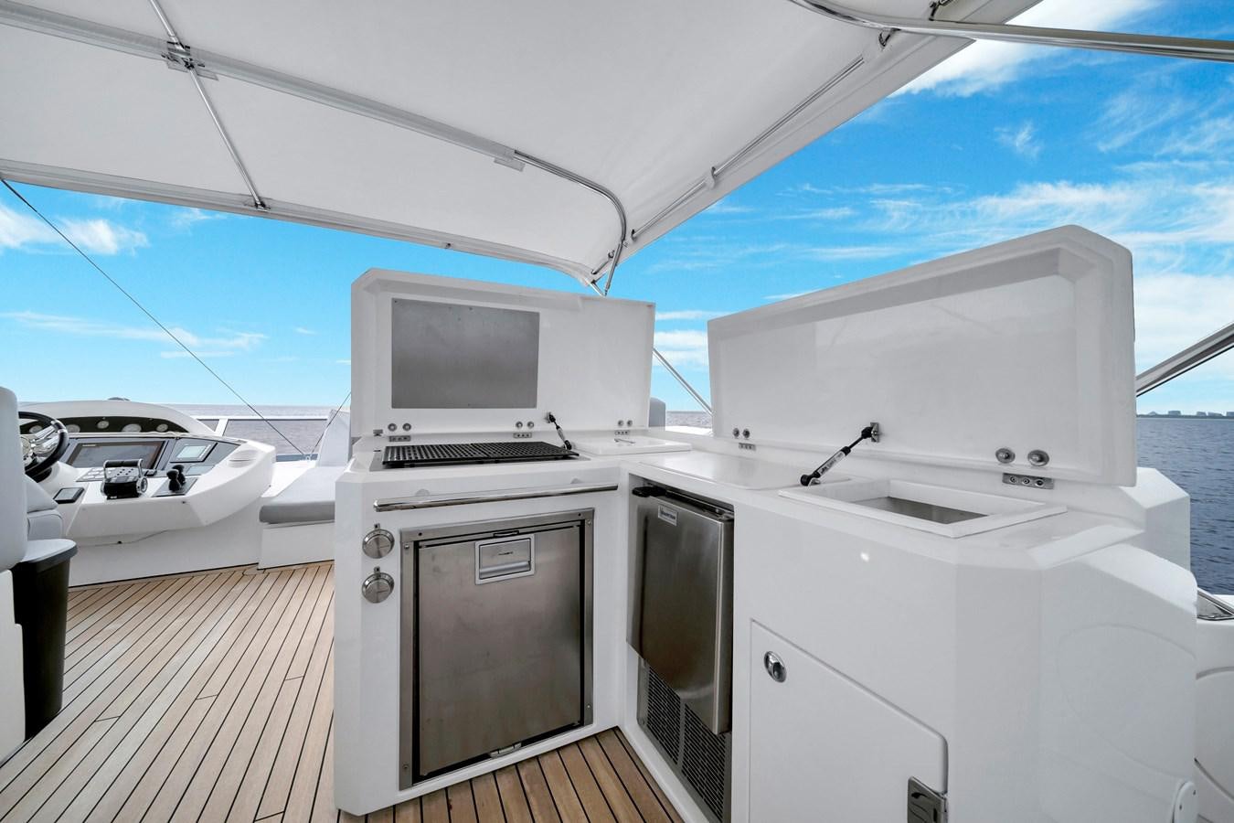 a boat with a tv and a couple of microwaves on it aboard QUATTRO Yacht for Sale