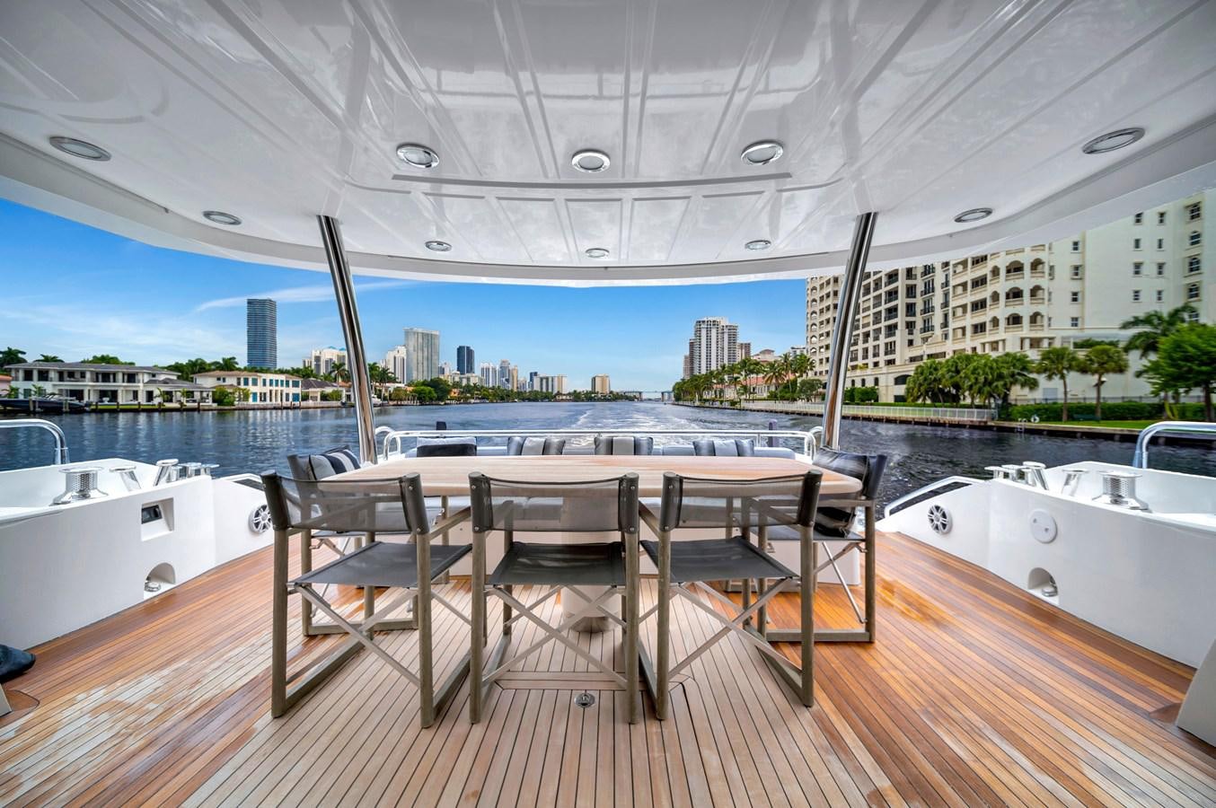 a table and chairs on a deck aboard QUATTRO Yacht for Sale