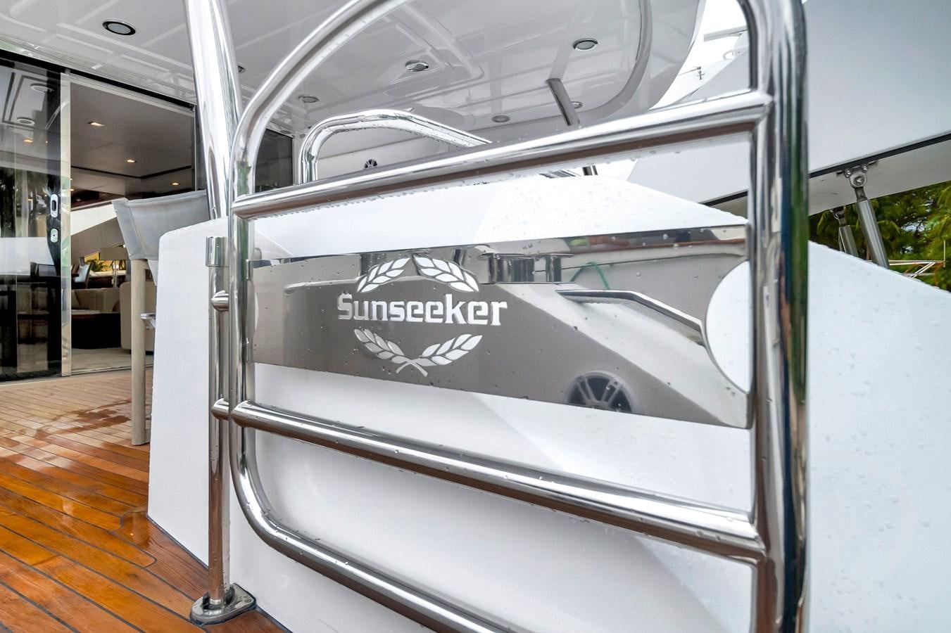 a silver car with a white logo aboard QUATTRO Yacht for Sale