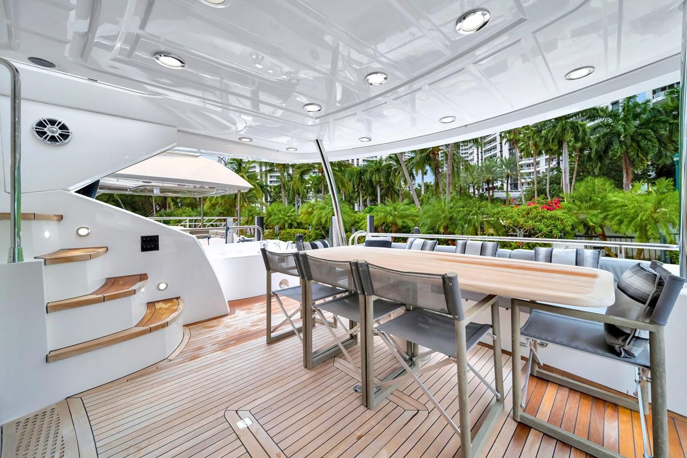 a room with tables and chairs aboard QUATTRO Yacht for Sale