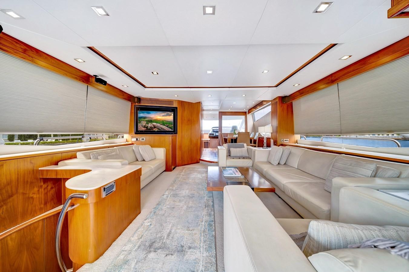 a room with a couch and a television aboard QUATTRO Yacht for Sale