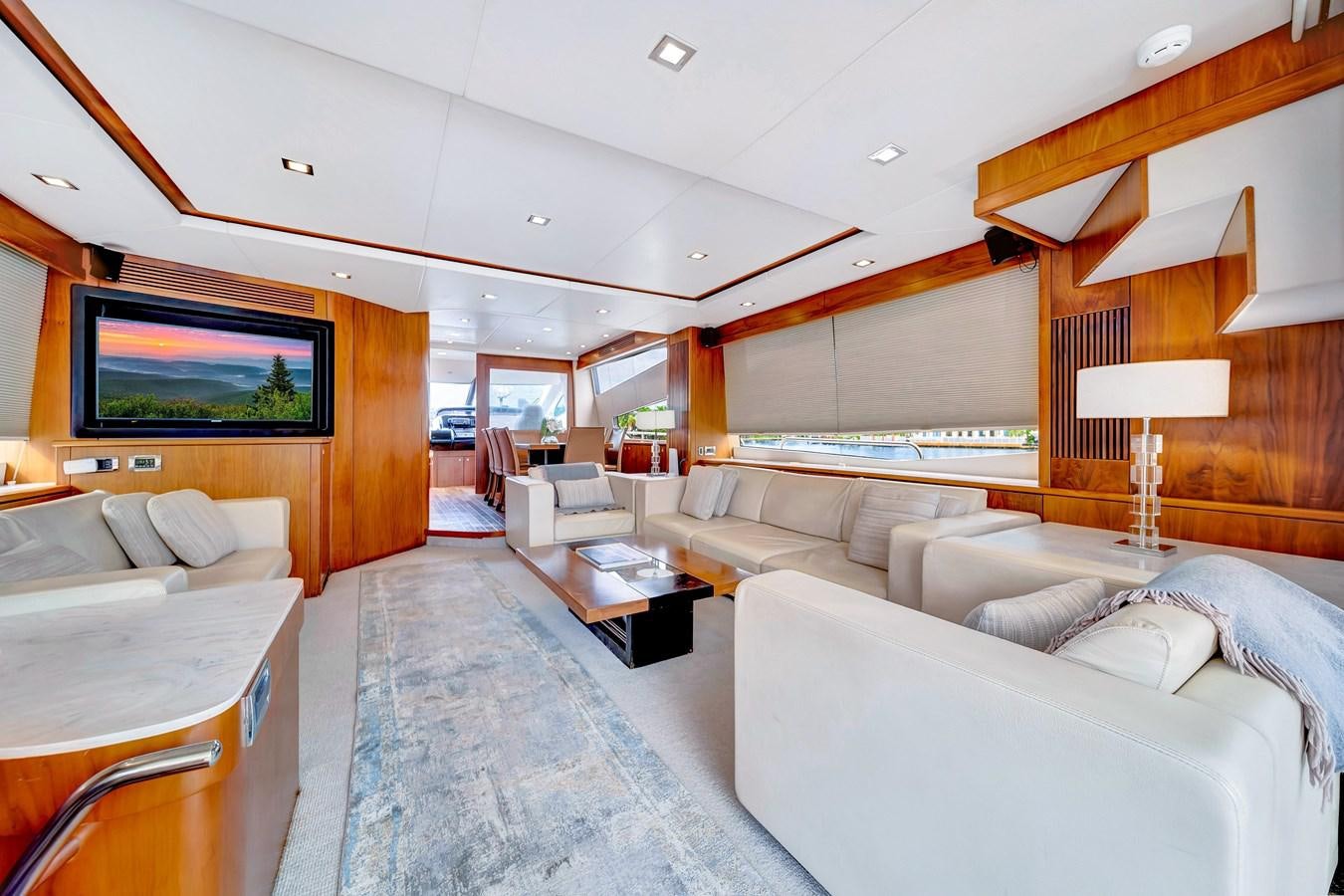 a living room with a large bed aboard QUATTRO Yacht for Sale