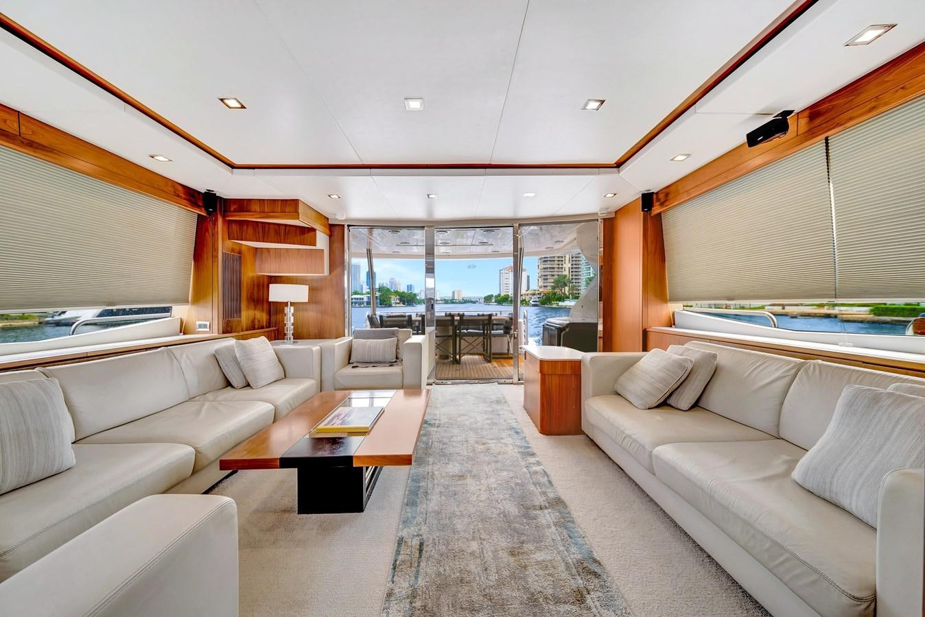 a living room with a large window aboard QUATTRO Yacht for Sale