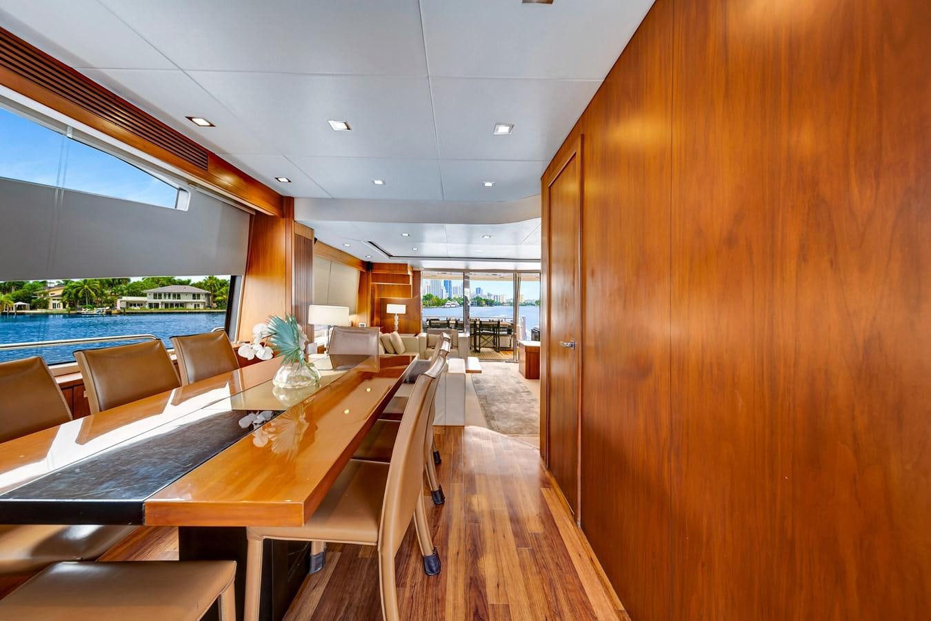 a room with a pool table and chairs aboard QUATTRO Yacht for Sale