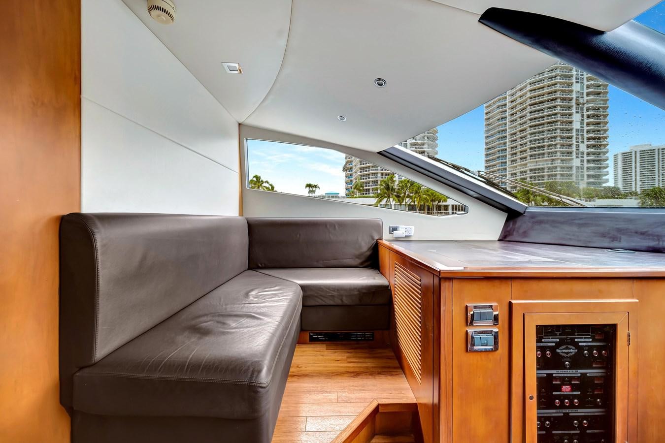 a living room with a couch and a tv aboard QUATTRO Yacht for Sale