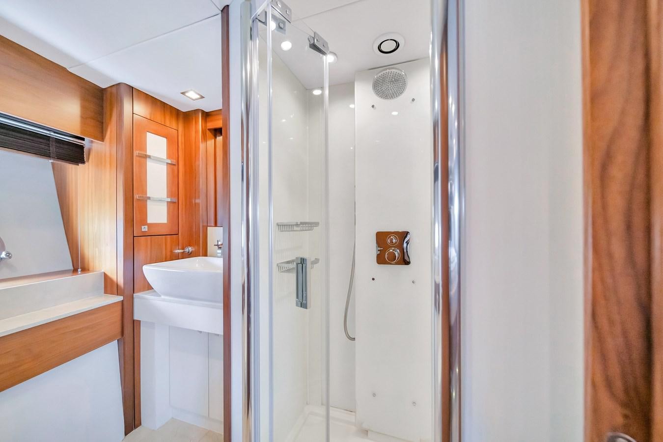 a bathroom with a shower unit and sink aboard QUATTRO Yacht for Sale