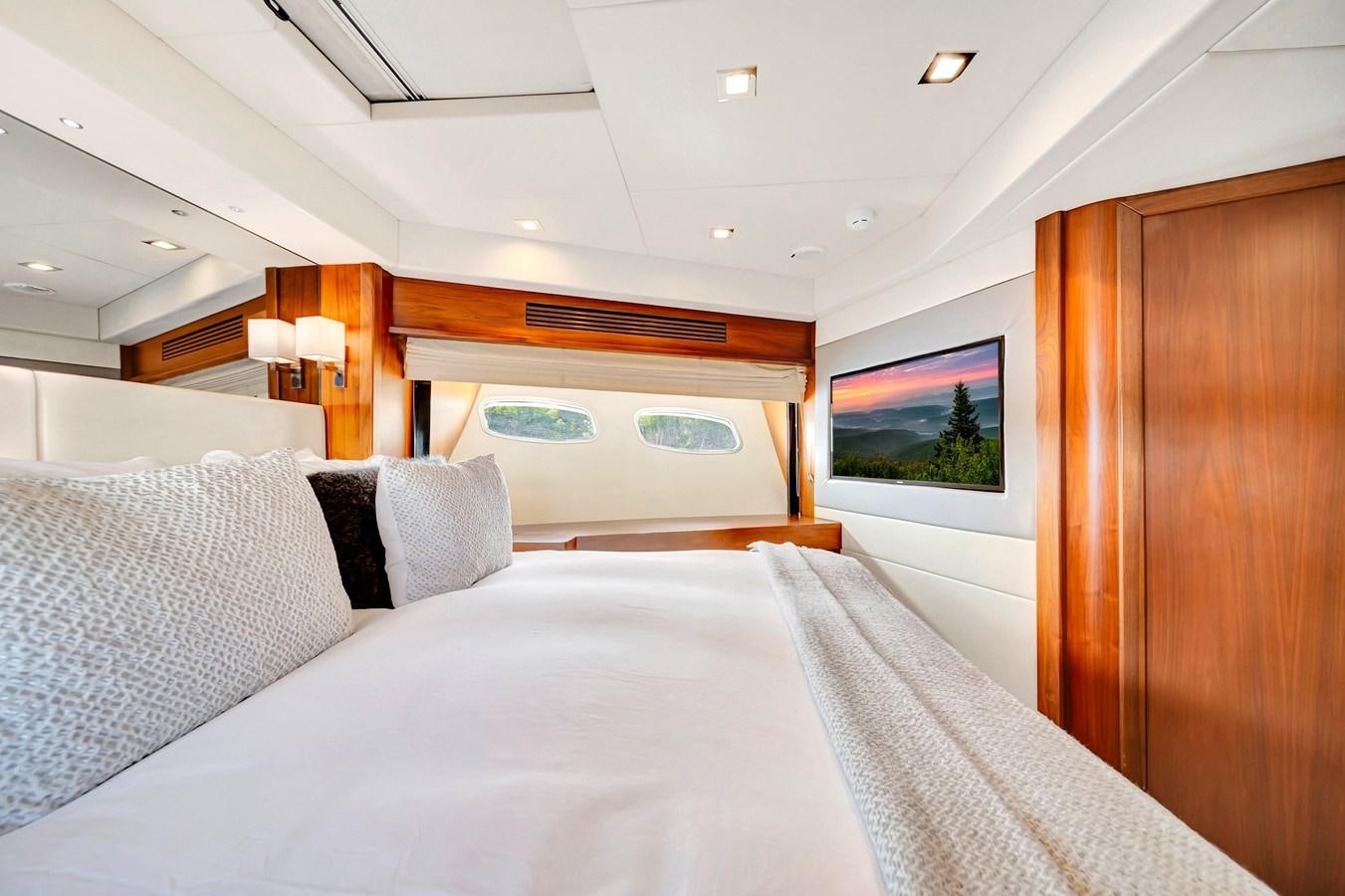 a bed with white sheets aboard QUATTRO Yacht for Sale