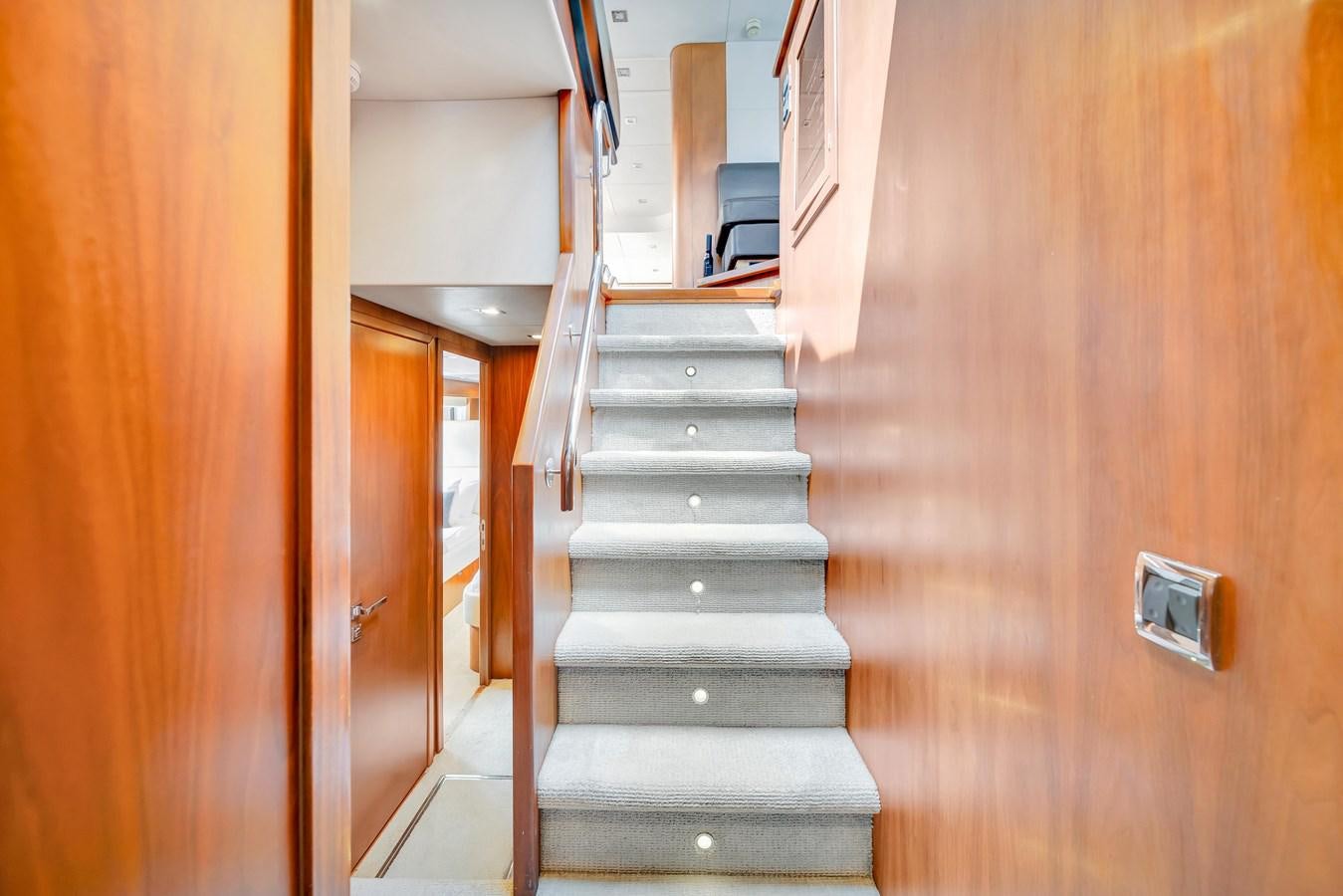 a wooden staircase in a house aboard QUATTRO Yacht for Sale