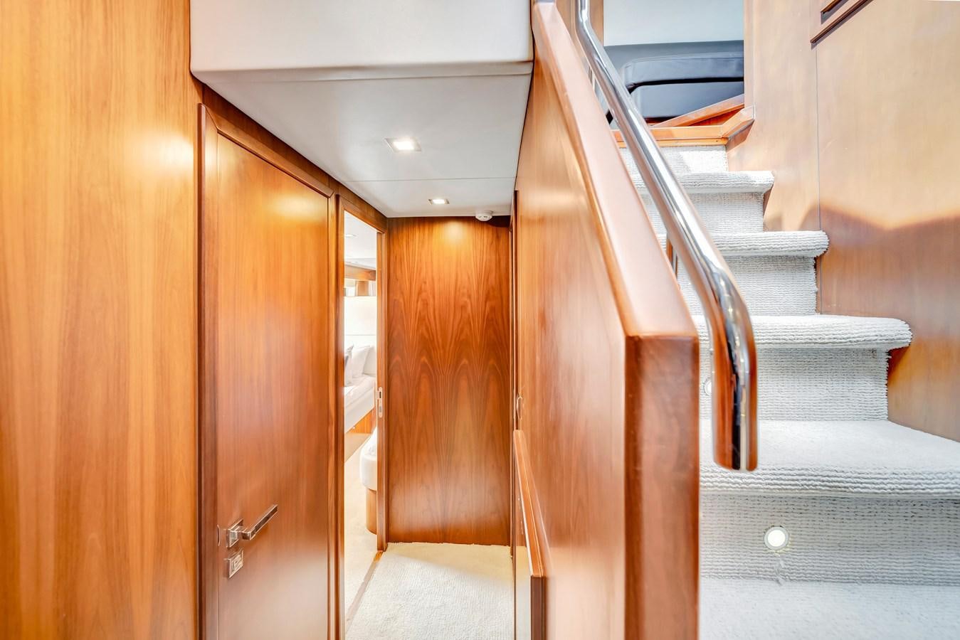 a set of wooden stairs aboard QUATTRO Yacht for Sale