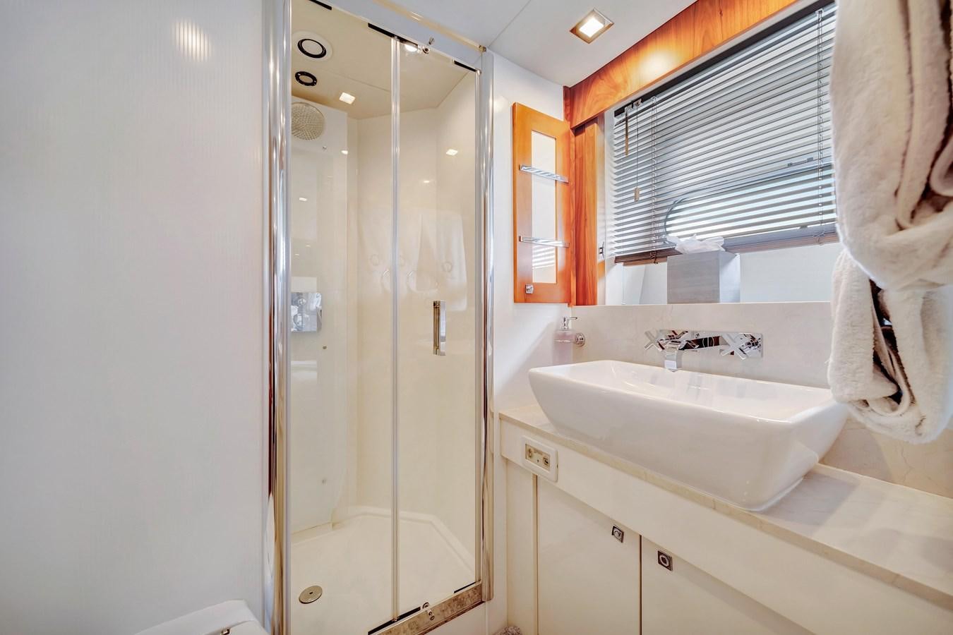 a bathroom with a glass shower aboard QUATTRO Yacht for Sale