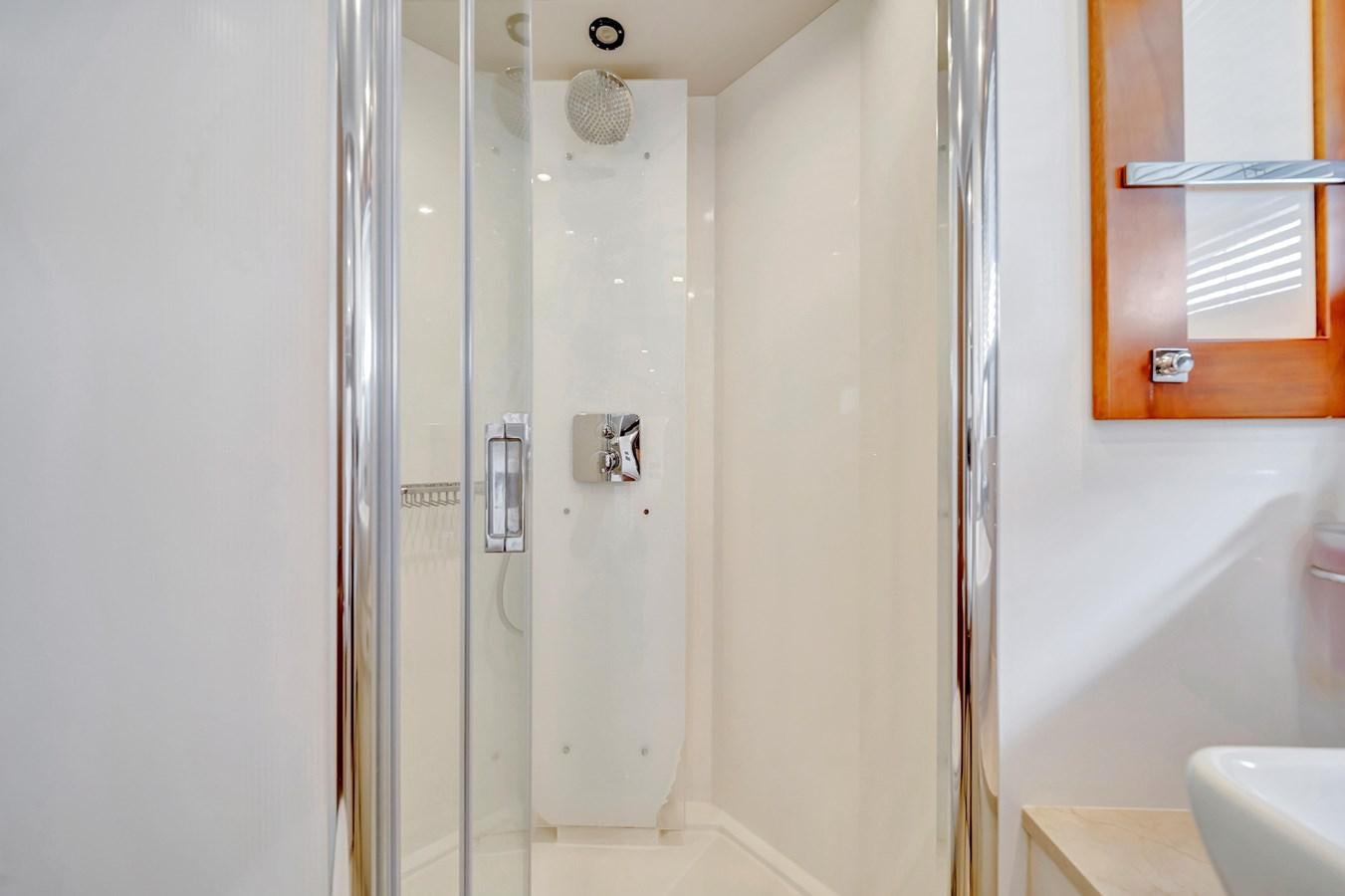 a bathroom with a shower unit aboard QUATTRO Yacht for Sale