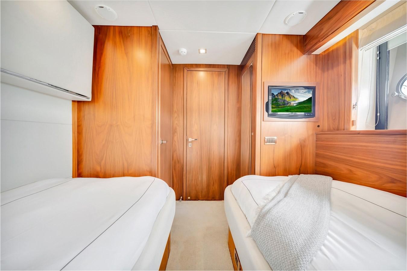 a room with wooden furniture aboard QUATTRO Yacht for Sale