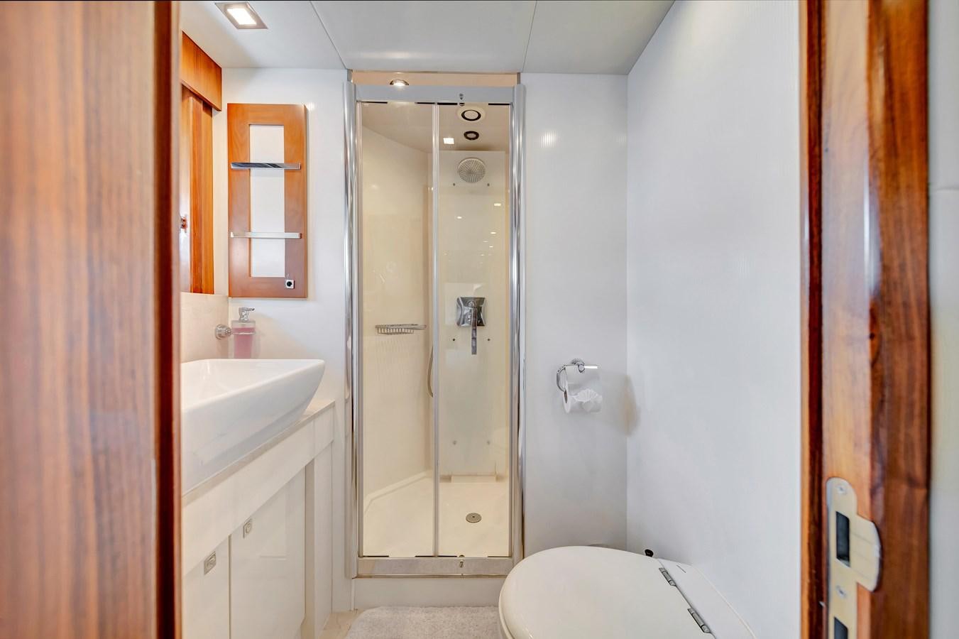 a bathroom with a glass shower aboard QUATTRO Yacht for Sale