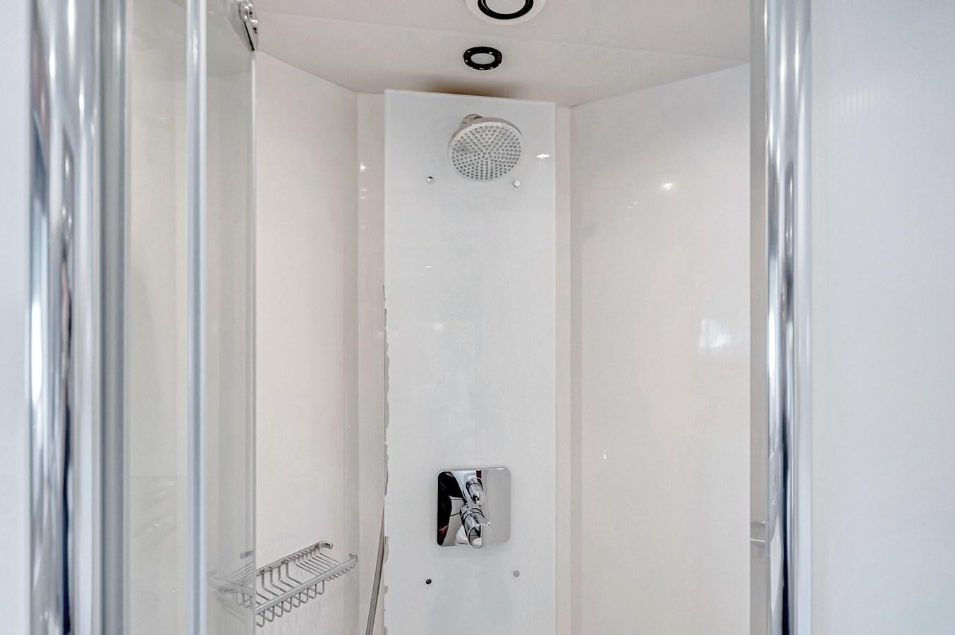 a white wall with a light switch aboard QUATTRO Yacht for Sale