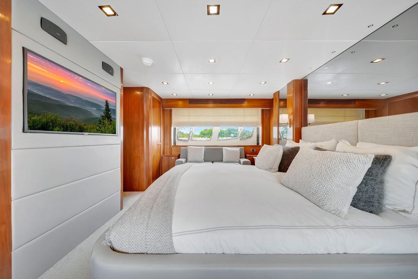 a large bed in a room aboard QUATTRO Yacht for Sale
