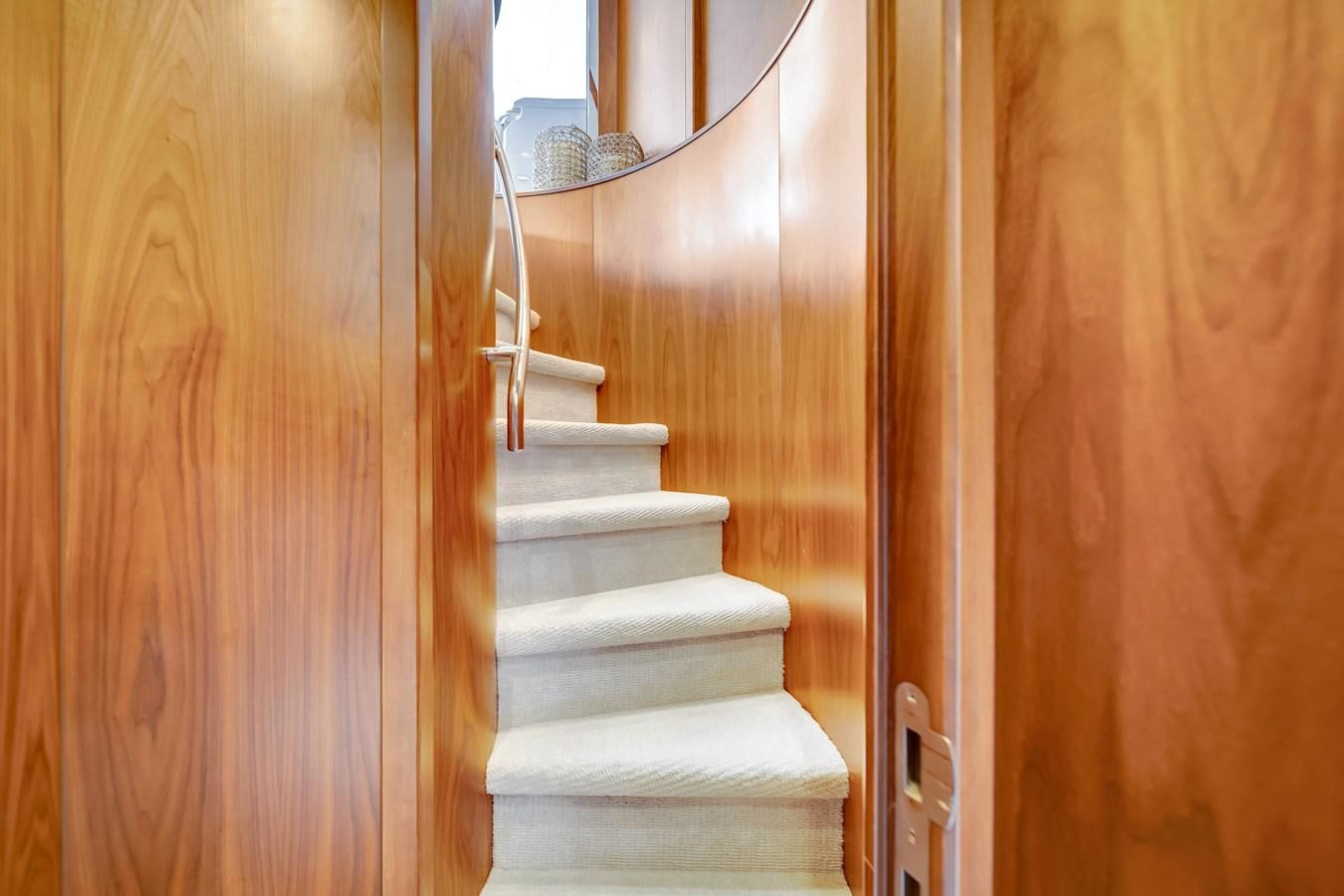 a white staircase in a house aboard QUATTRO Yacht for Sale