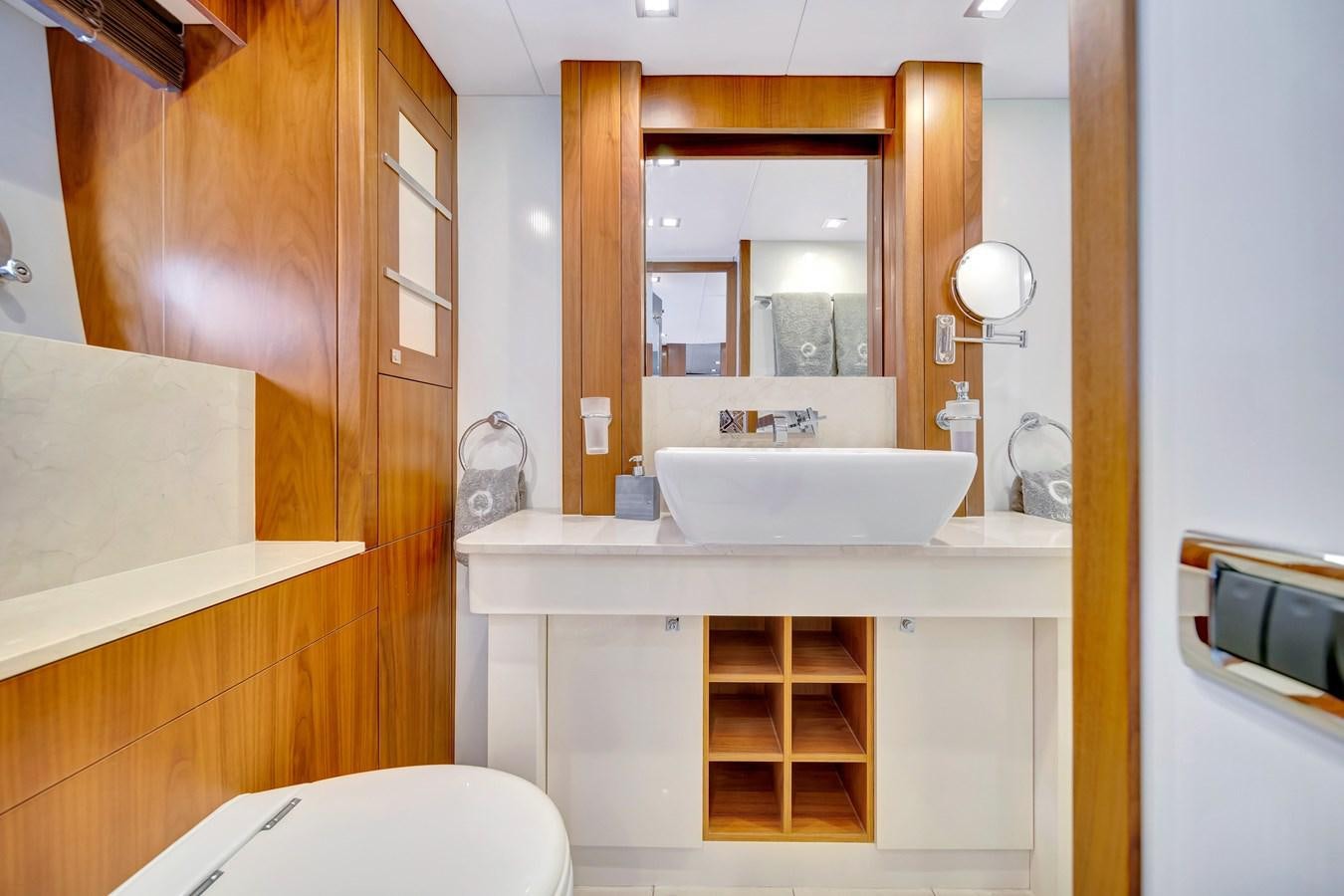 a bathroom with a sink and a mirror aboard QUATTRO Yacht for Sale