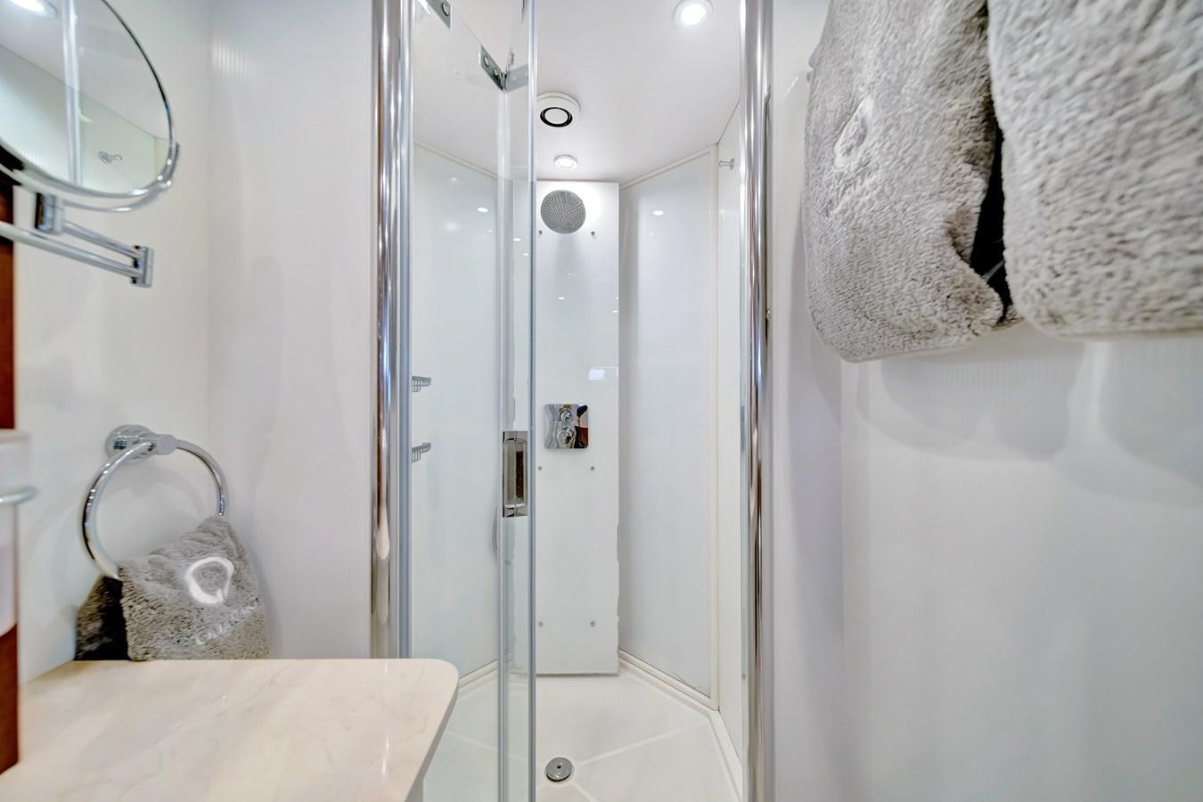 a bathroom with a shower and a towel on the wall aboard QUATTRO Yacht for Sale