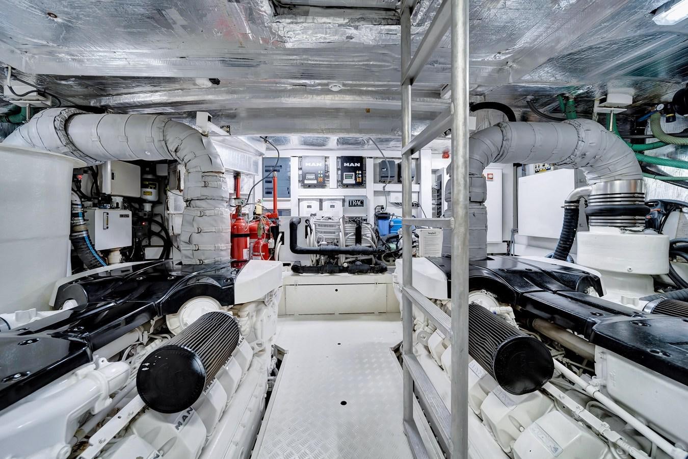 a room with pipes and equipment aboard QUATTRO Yacht for Sale