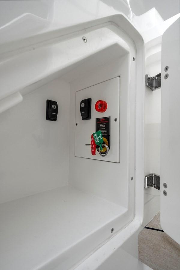 a white wall with a red and black sign on it aboard SAN PEDRO Yacht for Sale