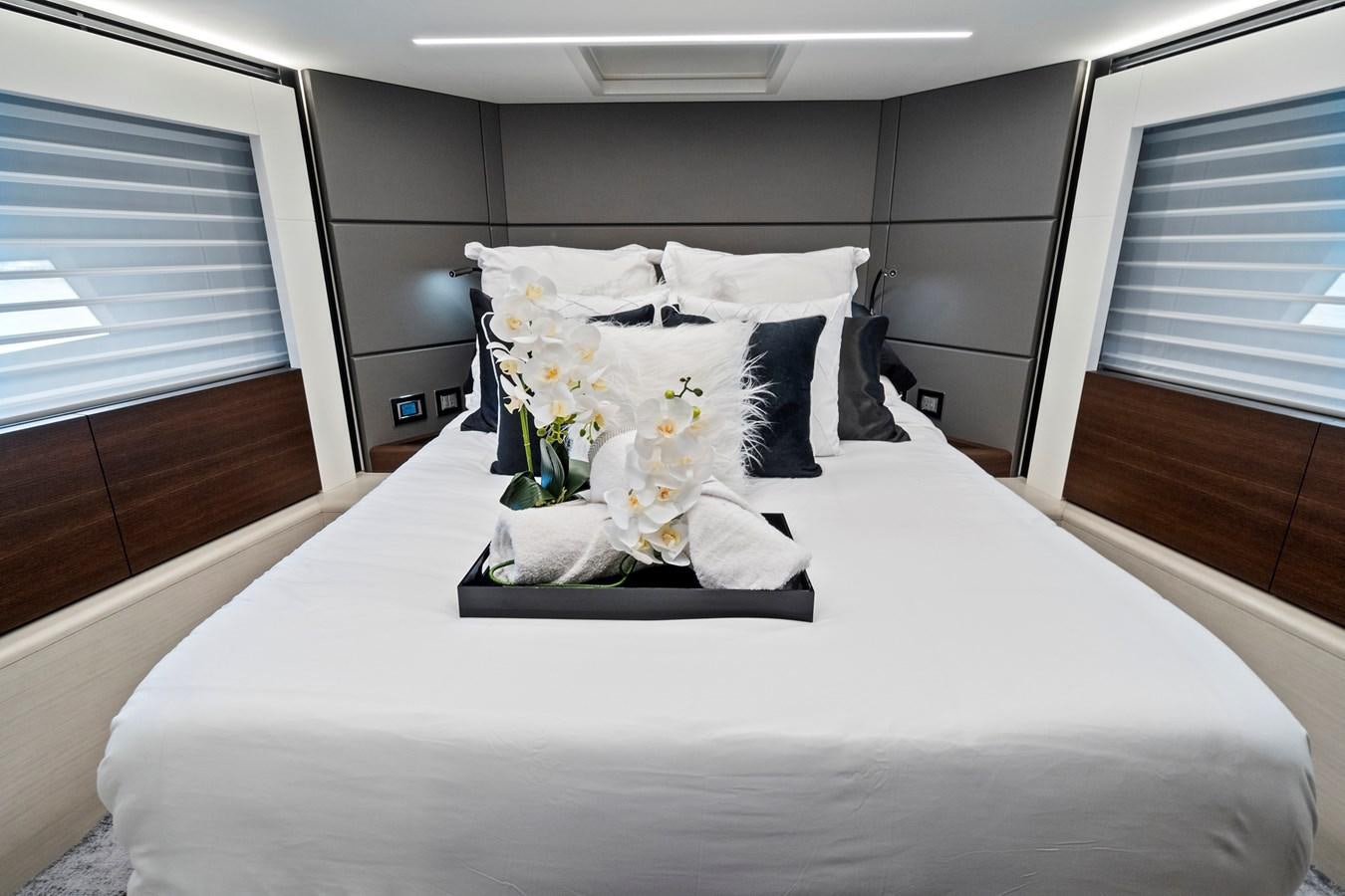 a bed with white sheets and pillows aboard SAN PEDRO Yacht for Sale