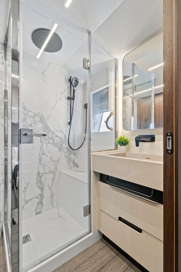 a bathroom with a glass shower aboard SAN PEDRO Yacht for Sale