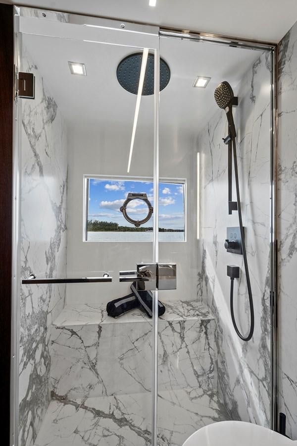 a bathroom with a mirror and shower aboard SAN PEDRO Yacht for Sale