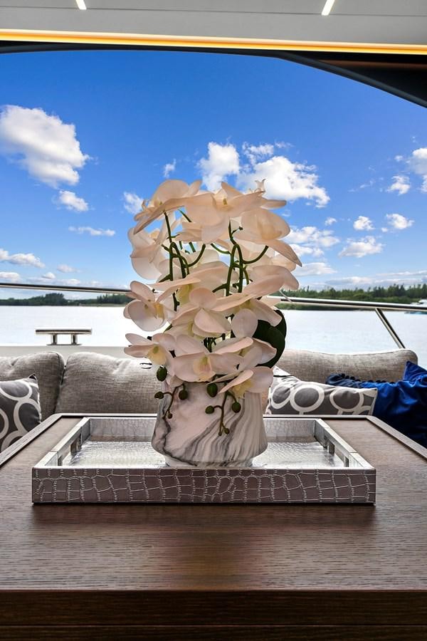 a vase with flowers on a table aboard SAN PEDRO Yacht for Sale