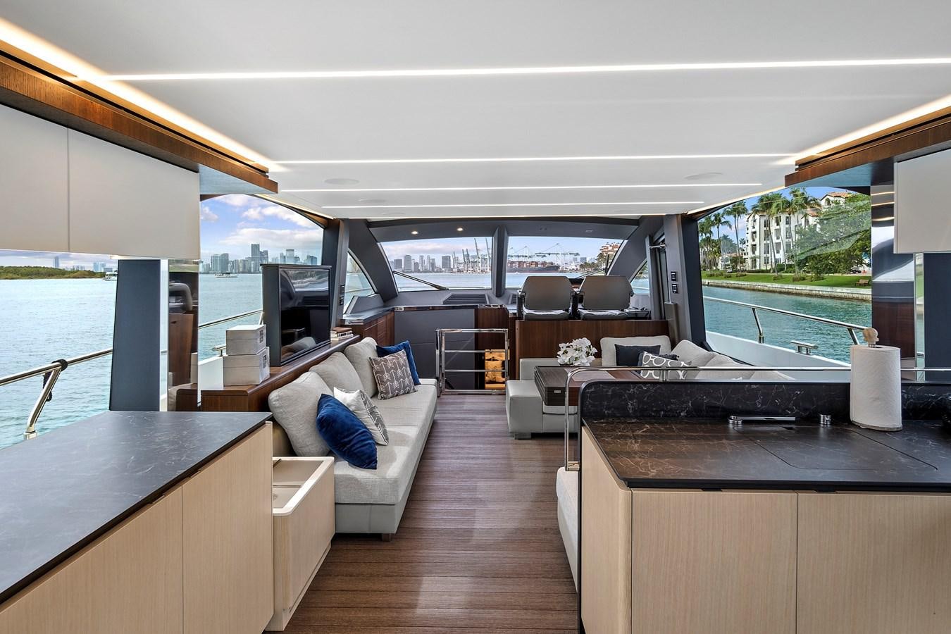 a room with a view of the ocean and a city aboard SAN PEDRO Yacht for Sale