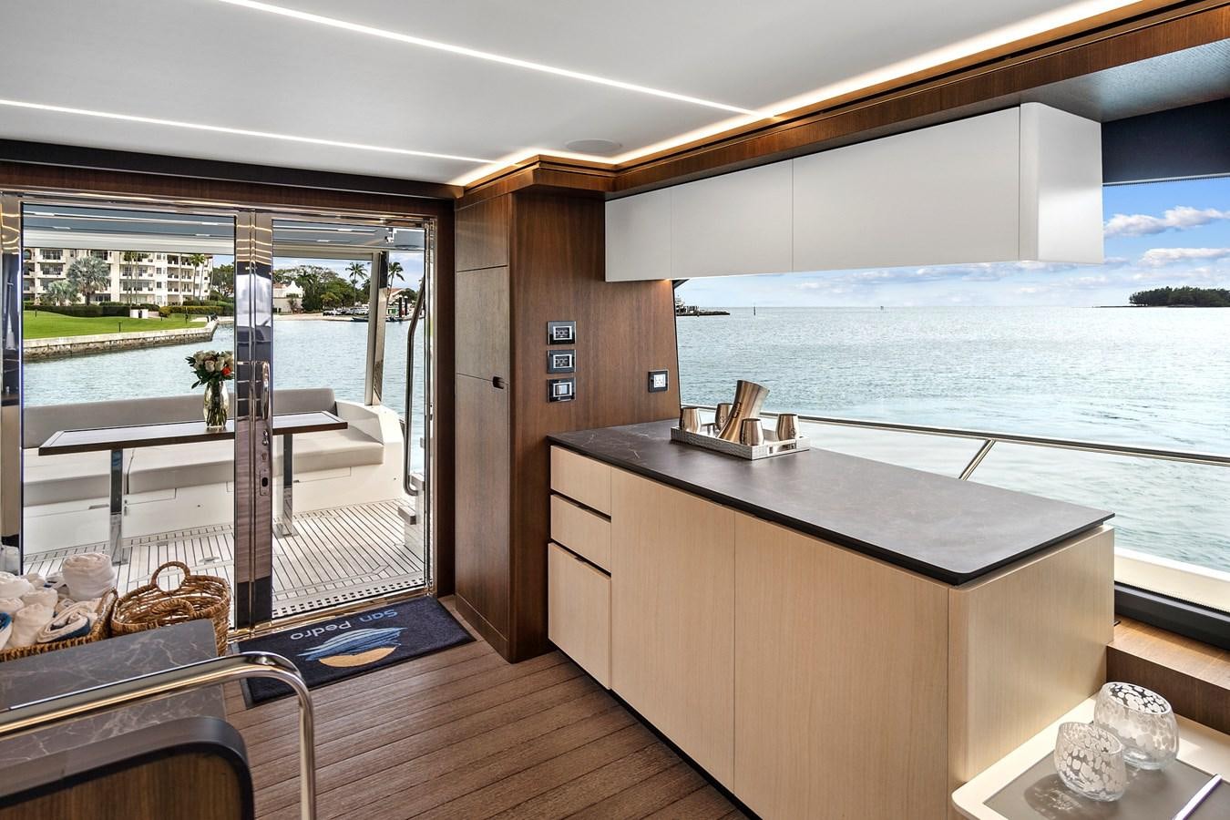 a room with a large window and a view of the water aboard SAN PEDRO Yacht for Sale