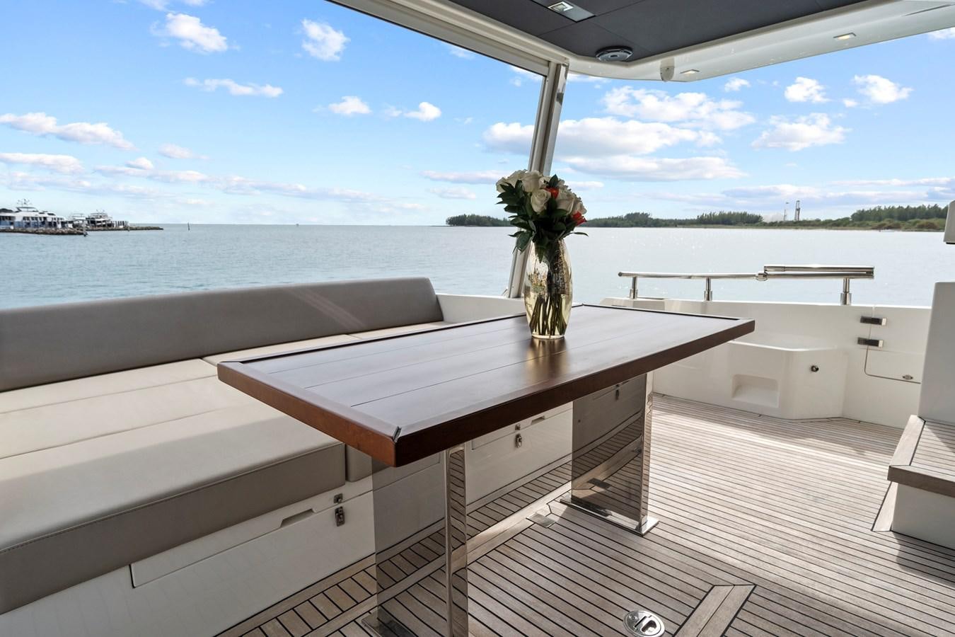 a vase of flowers on a table aboard SAN PEDRO Yacht for Sale
