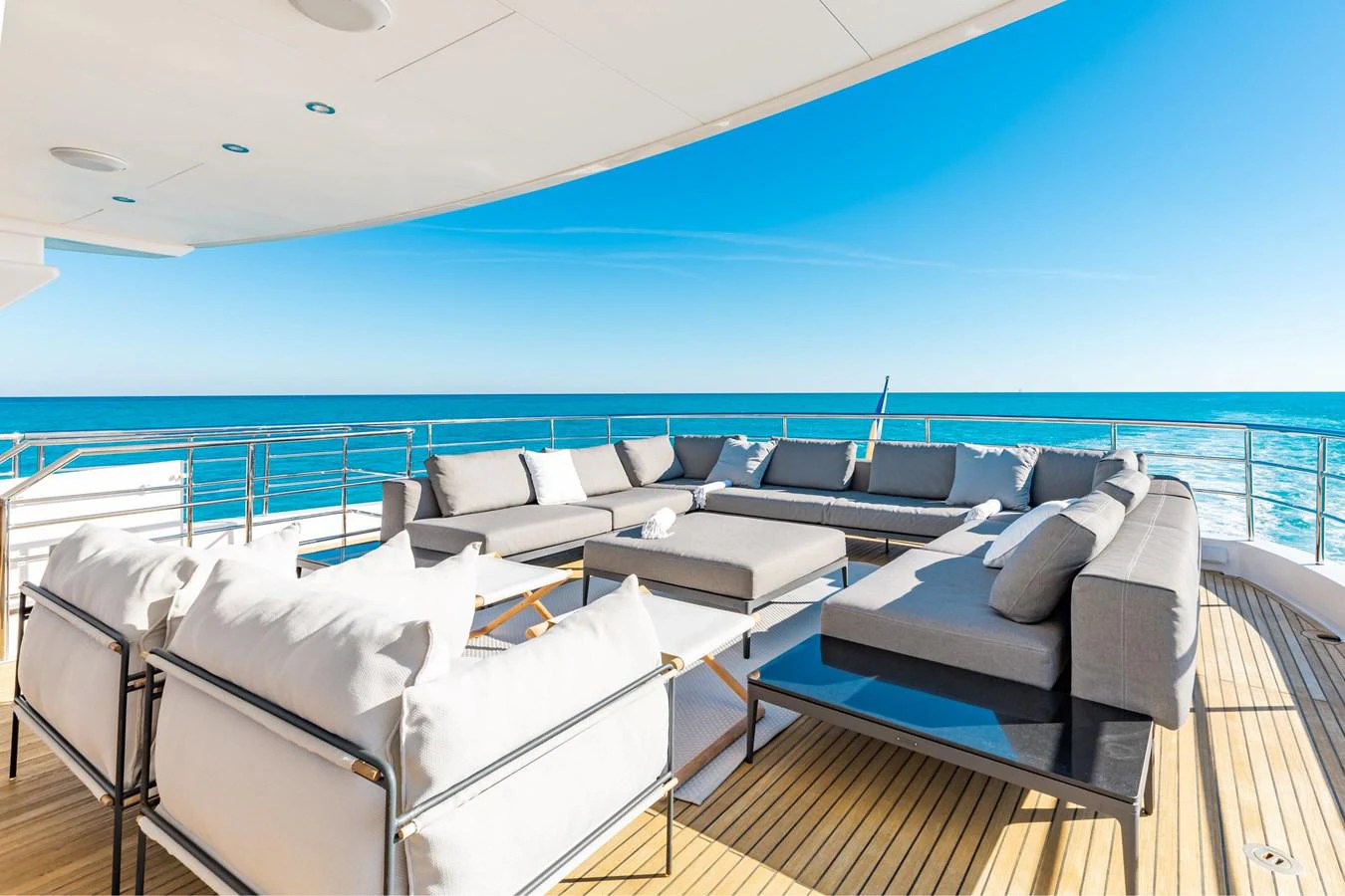 a room with a deck and chairs aboard ADAGIO Yacht for Sale
