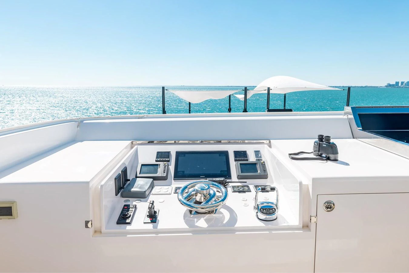 a white boat with a laptop on it aboard ADAGIO Yacht for Sale