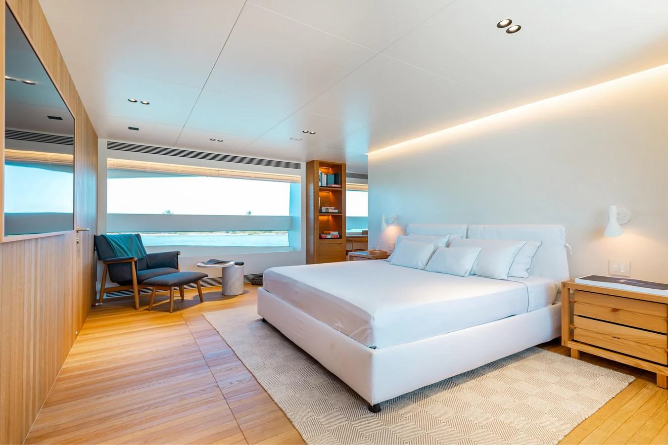 a room with a bed and a chair aboard ADAGIO Yacht for Sale