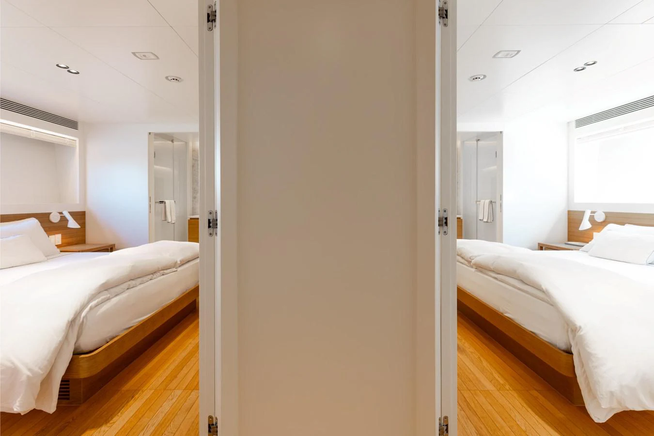 a room with two beds aboard ADAGIO Yacht for Sale