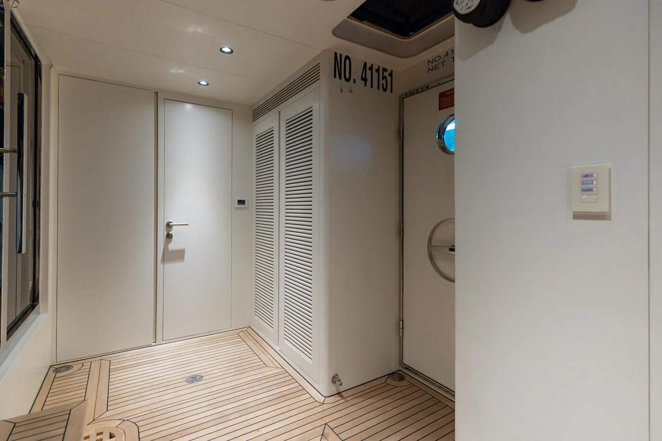 a room with a door and a window aboard ADAGIO Yacht for Sale